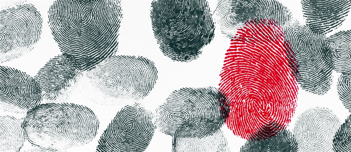 Numerous Black Fingerprints with One Red Fingerprint