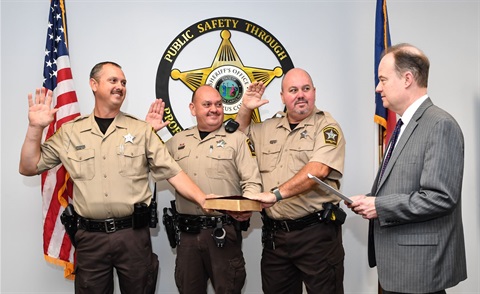 Jason Crayton (far left), John Crayton (middle left) and Rick Crayton (middle right) sworn in by Judge Marty McGee 