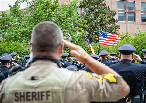Deputy salutes during the 2021 Law Day event