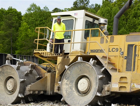 Ron Hoffman with compactor.jpg