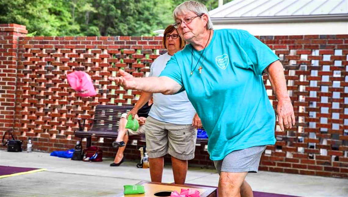 Women Playing Cornhole at the Concord Active Living Center