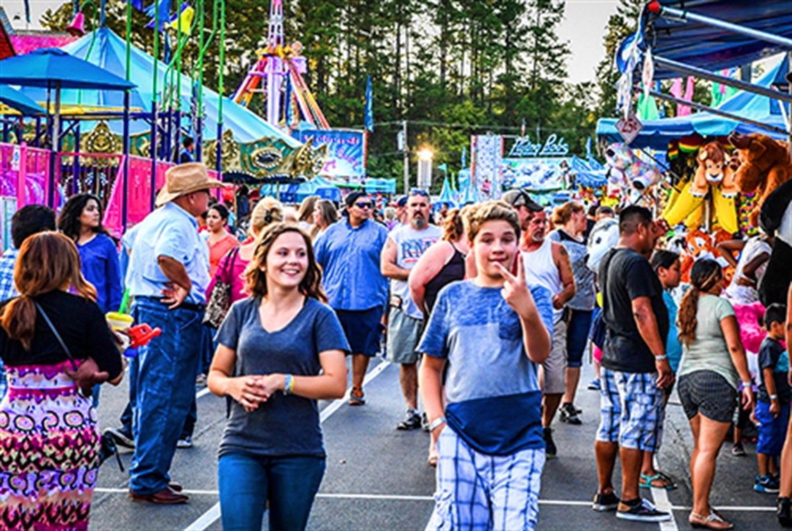Couple Walking the Midway at the Fair